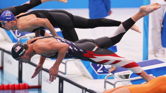 Michael Phelps (centre) was among the swimmers using the fast suits before they were banned.