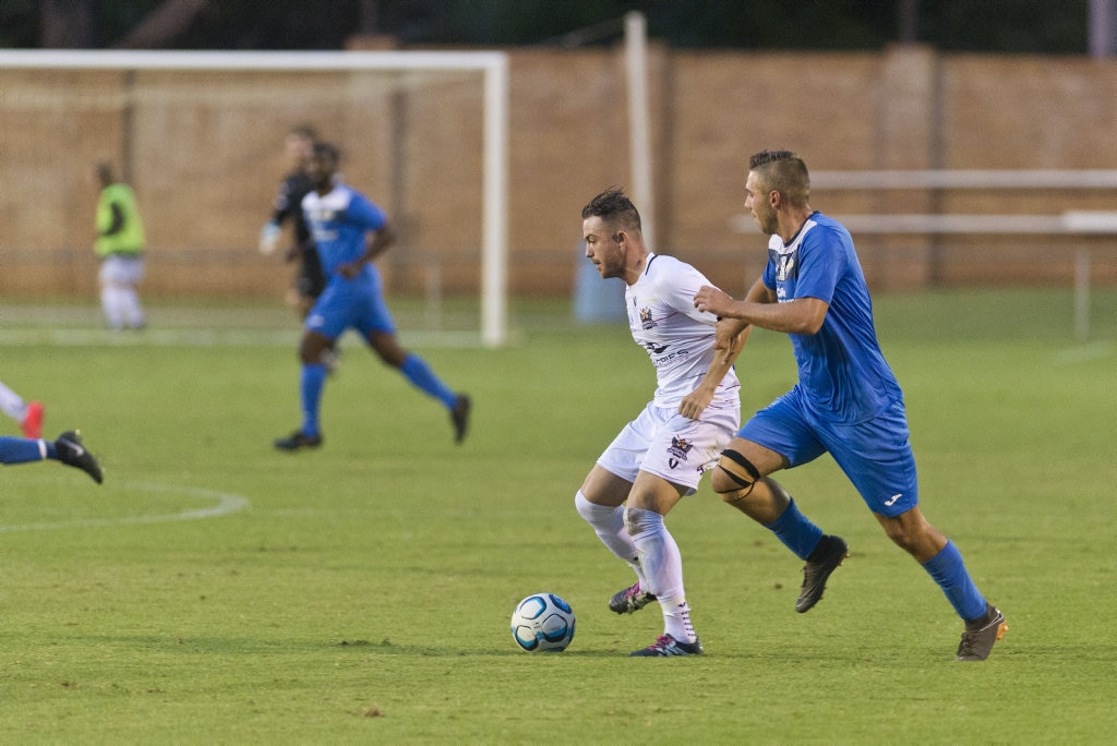 Liam Shipton of Magpies Crusaders and Anthony Grant of South West Queensland Thunder in NPL Queensland men round five football at Clive Berghofer Stadium, Saturday, March 2, 2019. Picture: Kevin Farmer