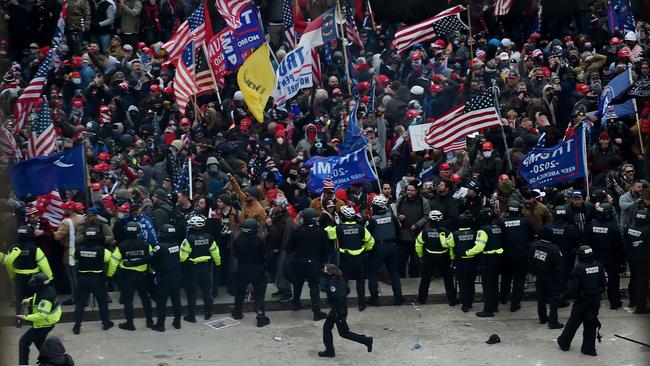 Police hold back supporters of US President Donald Trump as they gather outside the US Capitol. Picture: Olivier Douliery/AFP