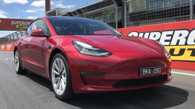 Mitsubishi says that currently, hybrid vehicles are better suited to Australian conditions than fully-electric cars such as the Tesla Model 3, pictured.