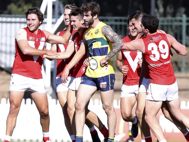 North Adelaide players celebrate a goal in their impressive triumph over Woodville-West Torrens. Picture: Sarah Reed