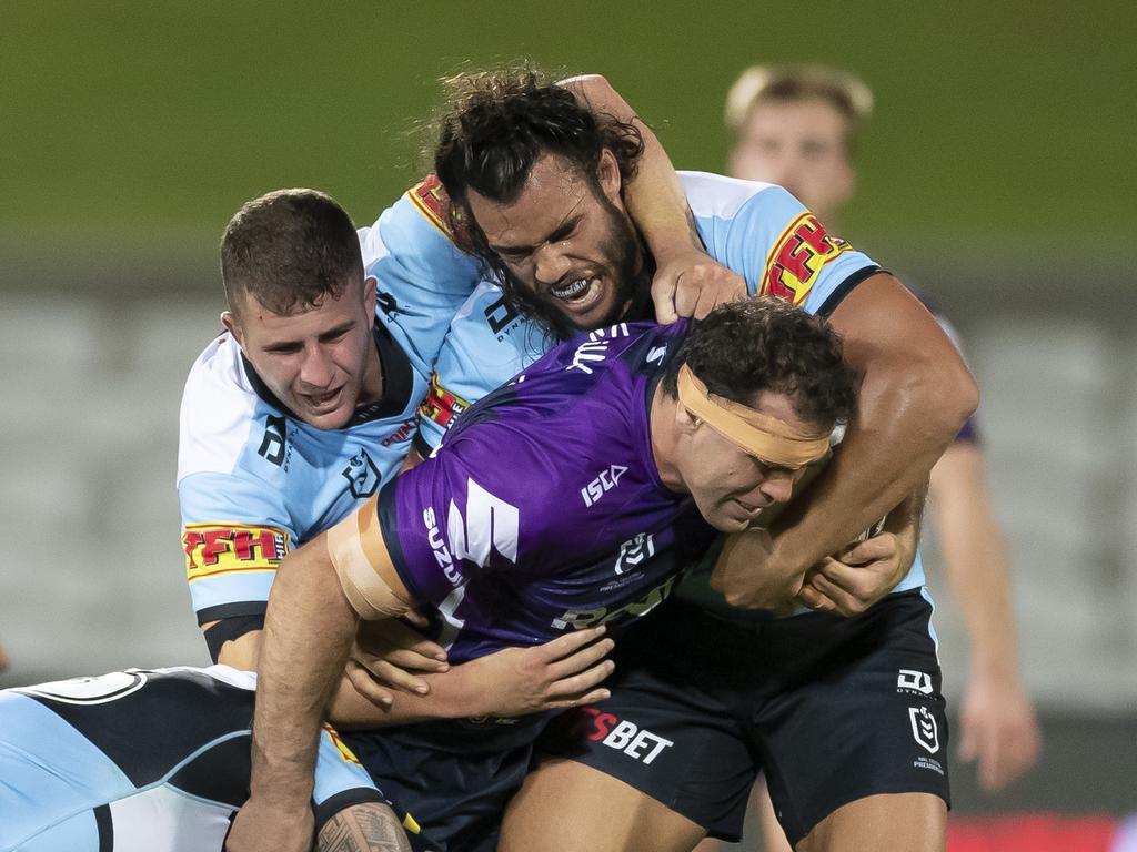 Dale Finucane of the Storm is tackled during the round 2 NRL match between Cronulla Sharks and Melbourne Storm at Netstrata Jubilee Stadium, in Sydney, Saturday, March 21, 2020. (AAP Image/Craig Golding) NO ARCHIVING, EDITORIAL USE ONLY