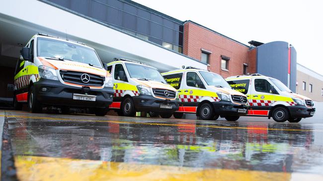 Ambulances wait to offload patients at Bankstown-Lidcombe Hospital in 2018 Picture: Luke Drew