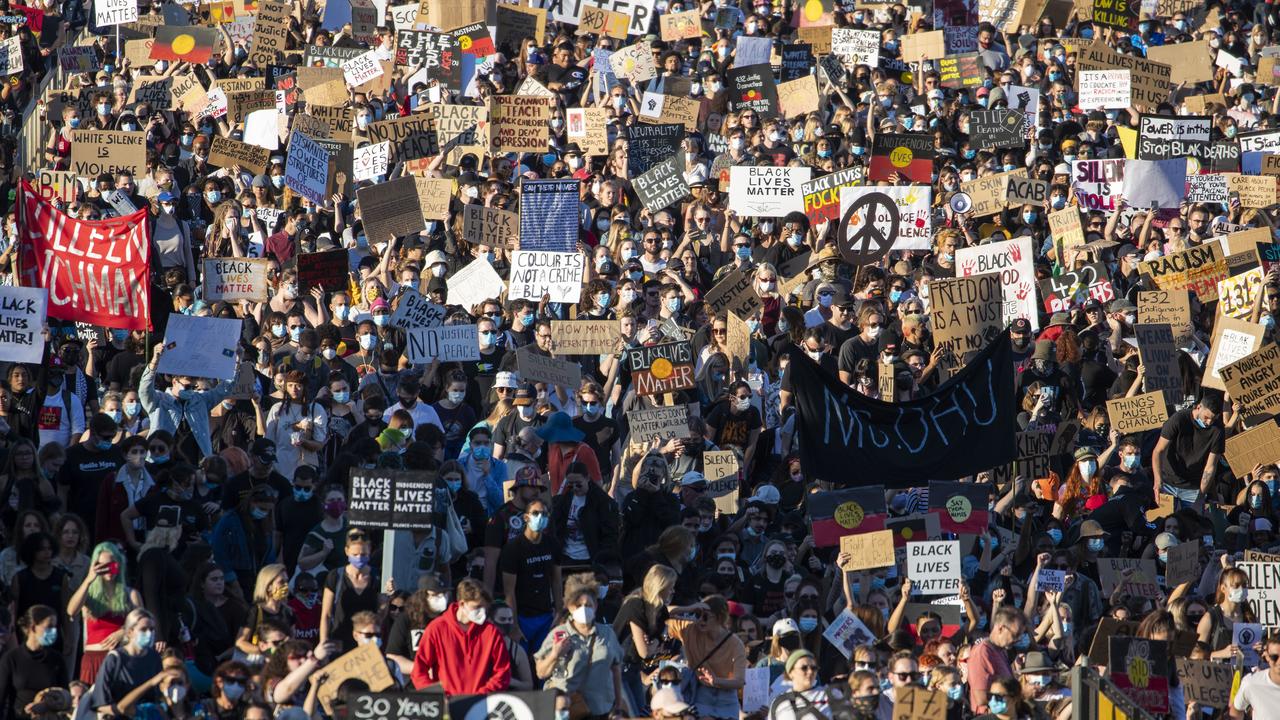 Protesters participate in a Black Lives Matter rally in Brisbane, Saturday, June 6, 2020. Thousands of people have flocked to inner-city Brisbane to protest police brutality against indigenous Australians and call for justice for those who have died in custody. (AAP Image/Glenn Hunt) NO ARCHIVING