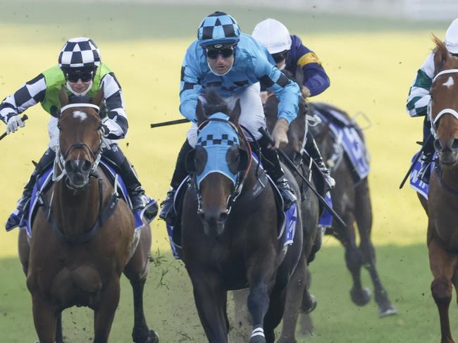 SYDNEY, AUSTRALIA - AUGUST 21: Tommy Berry (blue and black checks) on Mo'unga wins race 8 from James McDonald on Verry Elleegant the Winx Stakes during Sydney Racing at Royal Randwick on August 21, 2021 in Sydney, Australia. (Photo by Mark Evans/Getty Images)