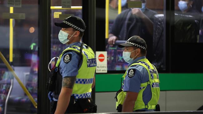 Police officers keep an eye on passengers in Perth. Picture: Getty Images