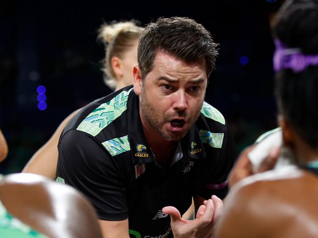 PERTH, AUSTRALIA - JULY 21: Dan Ryan, Coach of the Fever talks to the players at the 3rd quarter time break during the Super Netball Minor Semi Final match between West Coast Fever and Sunshine Coast Lightning at RAC Arena, on July 21, 2024, in Perth, Australia. (Photo by James Worsfold/Getty Images)