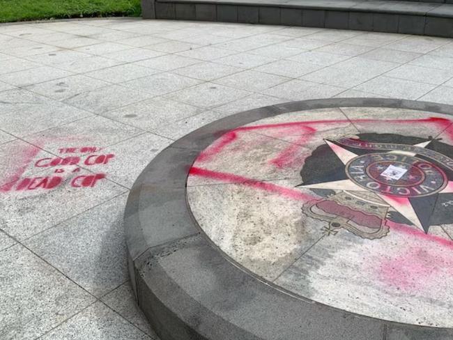 Offensive slurs including "the only good cop is a dead cop" were sprawled in red spray paint across the site. Picture: ABC News, Tania Lee