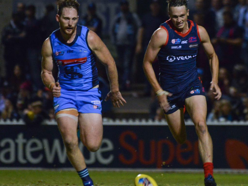 SANFL: Norwood v Sturt at Norwood Oval, Friday, April 12, 2019. Sturt's Aidan Riley beats Norwood's Tom Forster to the ball. (AAP Image/Brenton Edwards),