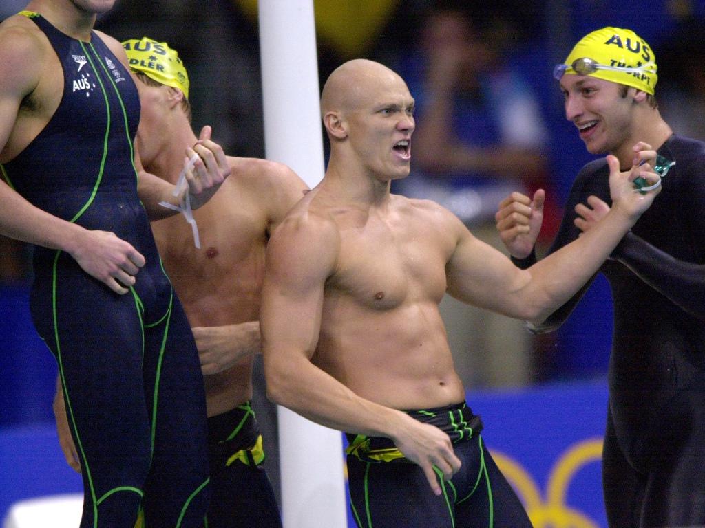 Michael Klim plays the air guitar after Australia won gold at Sydney 2000. Photo: Darren England/ALLSPORT