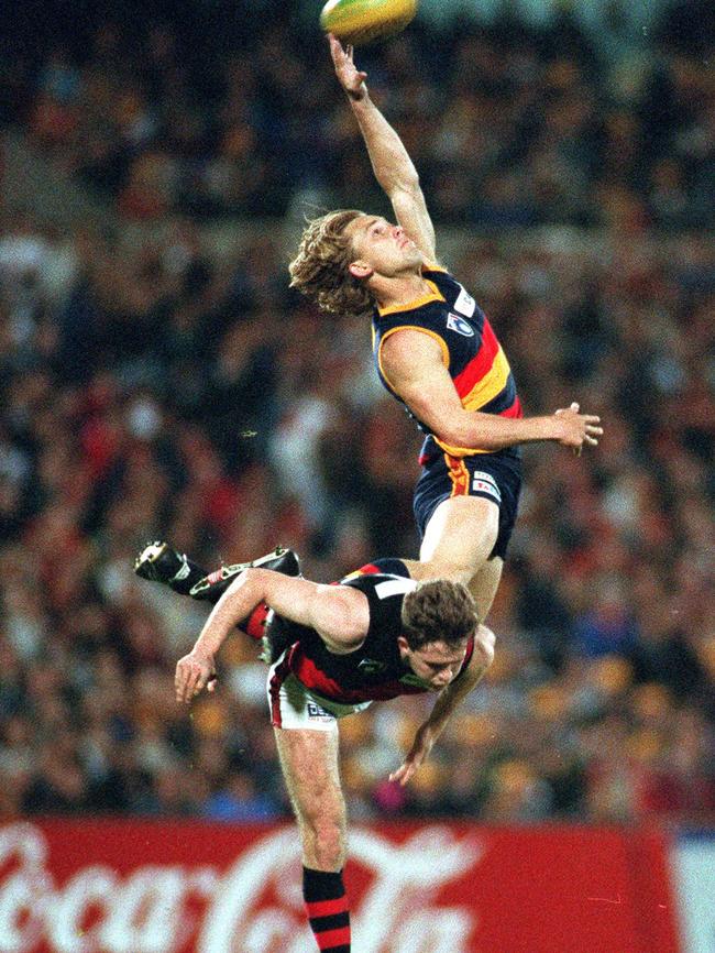 Crows superstar and former No. 6 Tony Modra shows his trademark flying capabilities.