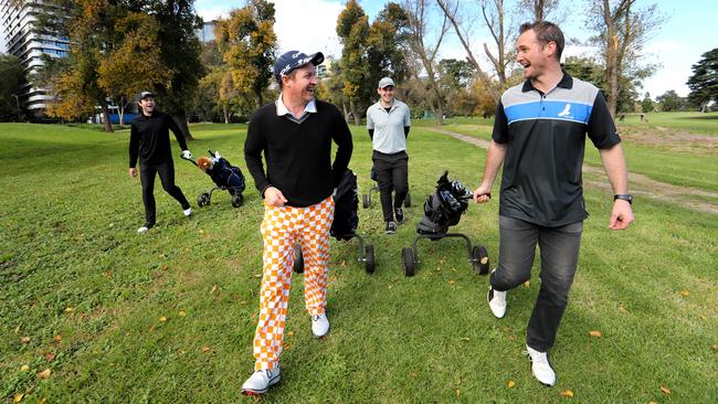 Sam Saunders, Dane Mackie, Woody Mahoney and Reece Tyrrell enjoy a round of golf at Albert Park golf course in Melbourne. Picture: David Geraghty