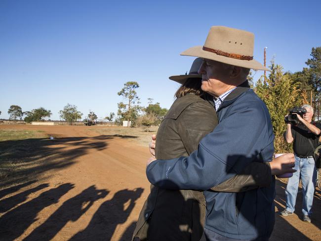 Prime Minister Malcolm Turnbull comforting charity worker Edwina Robertson in the town of Trangie, west of Dubbo, during his visit to drought stricken areas of regional NSW.