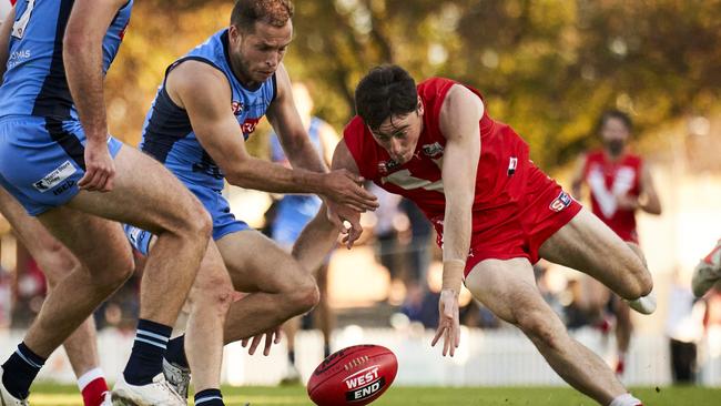 North Adelaide’s Cameron Hewett beats Sturt’s Guy Page to the ball in the Roosters' convincing win at Prospect Oval. Picture: Matt Loxton.