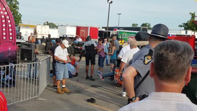 A person is attended to as authorities respond after the Fire Ball amusement ride accident. Picture: Justin Eckard via AP