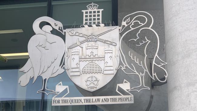 The crest of the Australian Capital Territory outside the ACT Law Courts which houses the ACT Magistrates Court and the ACT Supreme Court. Picture: Julia Kanapathippillai