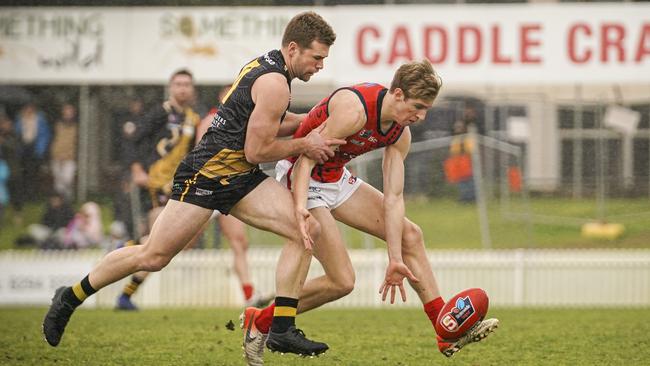 Norwood’s Dylan Stephens under pressure from Glenelg’s Andrew Bradley in 2019. Picture: MIKE BURTON/AAP