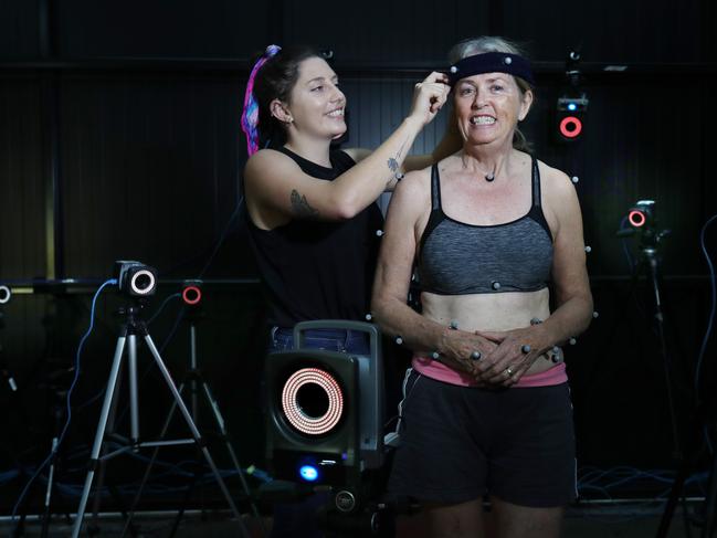 Australian Catholic University honours student Kate McMaster, who is conducting a pilot study into the benefits of motion capture technology in improving balance in Parkinson’s disease patients. Lynne Armes is a participant in the study. Picture: Annette Dew