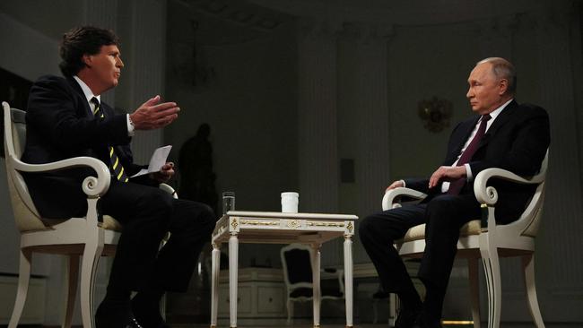 Russia's President Vladimir Putin gives an interview to US talk show host Tucker Carlson at the Kremlin.