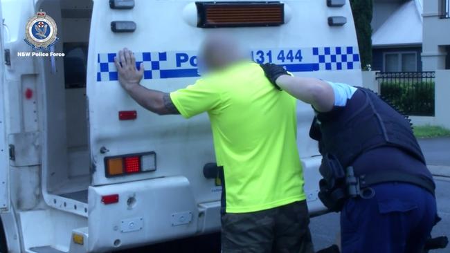 Hamid Ranjbarain, 37, is arrested at his home in North Parramatta on Wednesday. Picture: NSW Police