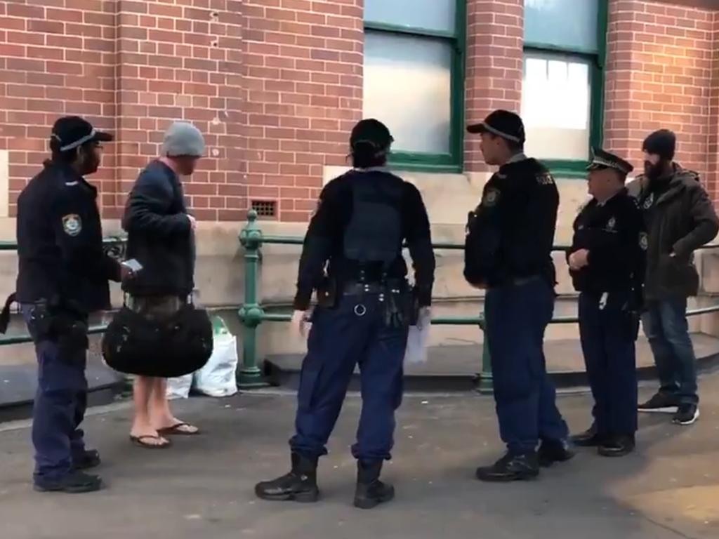 Police surround the man who tried to do a runner. Picture: Sydney Pead