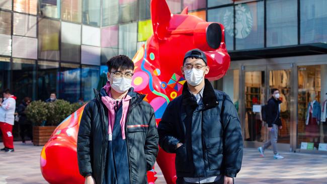 ‘We feel safe now’, says Wu Yang, right, during a celebratory shopping spree with his friend Zhu Yang in Beijing after weeks of confinement. Picture: Li Xiaonan