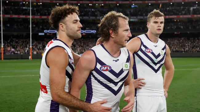 Griffin Logue (left) congratulates the retiring David Mundy after their semi-final loss. Picture: Michael Willson/AFL Photos via Getty Images