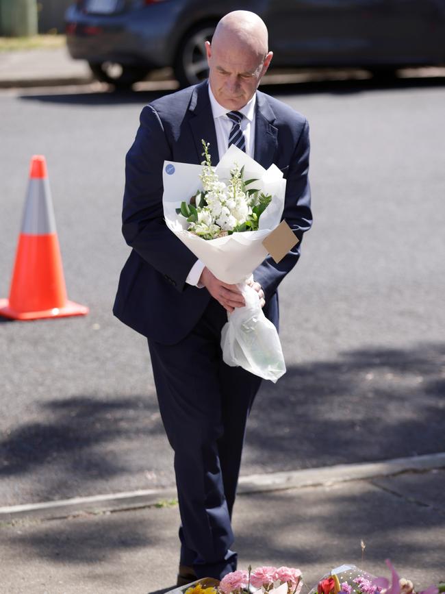 Premier Peter Gutwein lays flowers at Hillcrest Primary School. Picture: NCA Newswire / Grant Viney