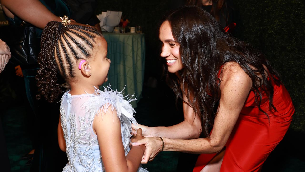 Meghan greets young Ella Nelson. Picture: Matt Winkelmeyer/Getty