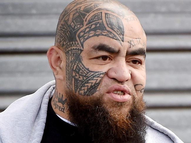 A comachero bikie Norm Meyer arrives the clubhouse and speaks with a detective. Police raid Comanchero bikie club house in Thistlewaite Street South Melbourne.  Picture: Nicole Garmston