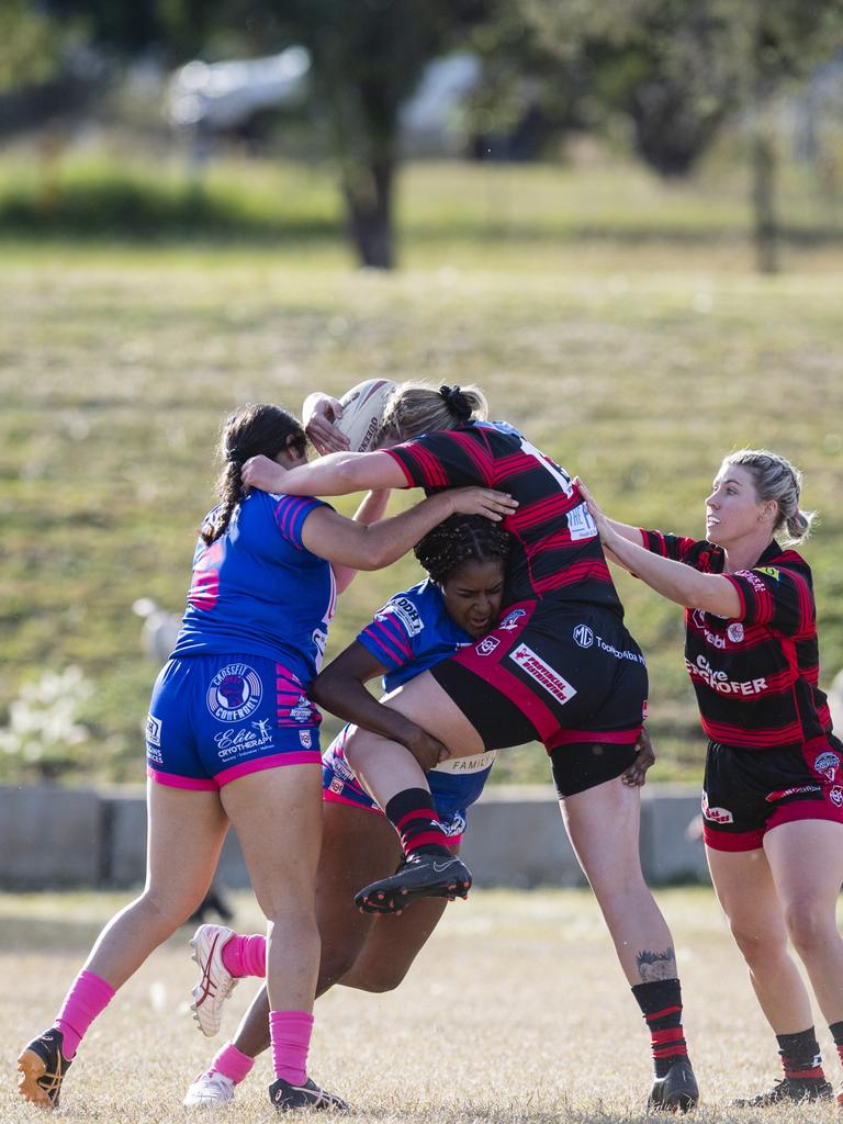 Aleah Peckham (left) and Anna Dingley make a tackle for Newtown on Emily Walker of Valleys.