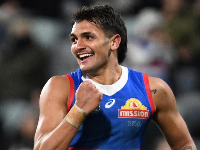 GEELONG, AUSTRALIA - JULY 20: Jamarra Ugle-Hagan of the Bulldogs celebrates kicking a goal during the round 19 AFL match between Geelong Cats and Western Bulldogs at GMHBA Stadium, on July 20, 2024, in Geelong, Australia. (Photo by Daniel Pockett/Getty Images)