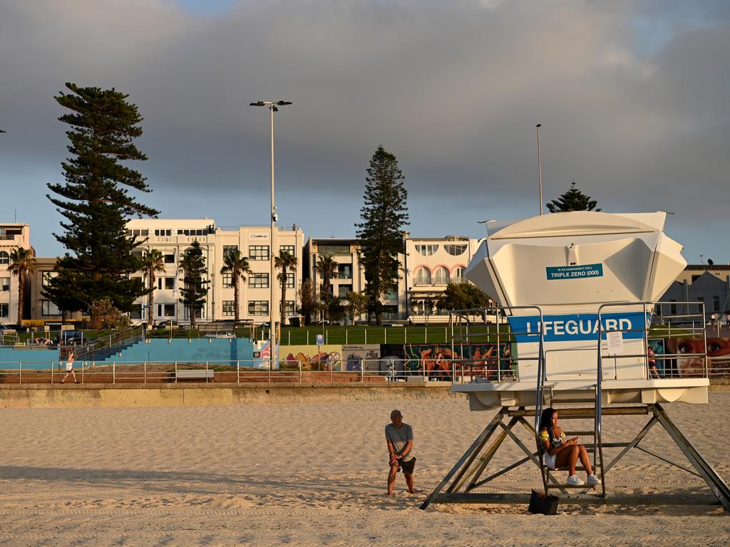Beachgoers are seen at sunrise at Bondi Beach in Sydney, Sunday, March 22, 2020. Picture: Joel Carrett