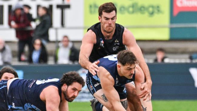 Lycett lays a tackle for Port District. Picture: Brenton Edwards