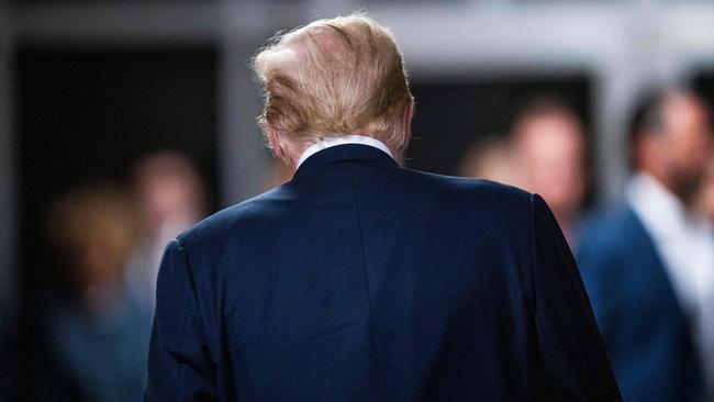 Donald Trump departs after speaking to the press after deliberations begin. Picture: AFP.