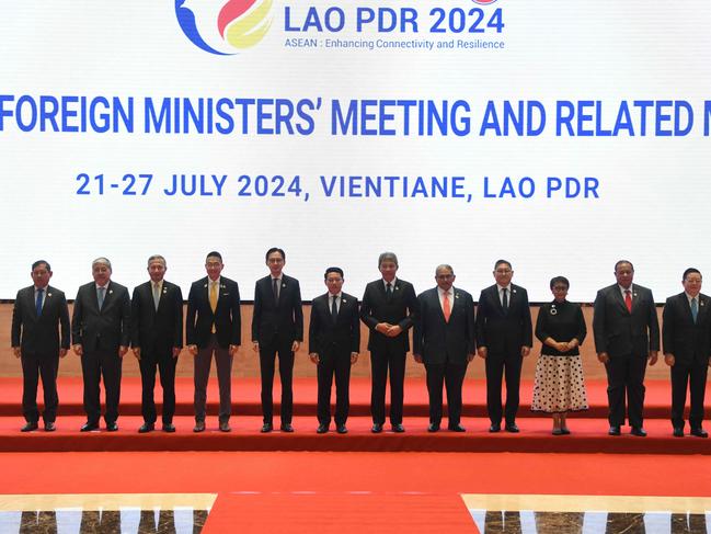 (L-R) Myanmar Permanent secretary of foreign affairs Aung Kyaw Moe, Philippine Secretary of Foreign Affairs Enrique Manalo, Singapore Foreign Minister Vivian Balakrishnan, Thailand Foreign Minister Maris Sangiampongsa, Vietnam Deputy Minister of Foreign Affairs Do Hung Viet, Laos Foreign Minister Saleumxay Kommasith, Malaysia Foreign Mohamad Hasan, Brunei Darussalam Minister of Foreign Affairs Erywan Yusof, Cambodia Foreign Minister Sok Chenda Sophea, Indonesia Foreign Minister Retno Marsudi, East Timor Foreign Minister Bendito dos Santos Freitas, Asean Secretary General Kao Kim Hourn pose for a family photo during the 57th Association of southeast Asian Nations (ASEAN) Foreign Ministers Plenary Meeting session in Vientiane on July 25, 2024. (Photo by Sai Aung MAIN / AFP)