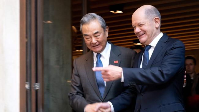 German Chancellor Olaf Scholz and Chinese Foreign Minister Wang Yi shake hands at a bilateral meeting during the 61st Munich Security Conference. Picture: Pool/AFP