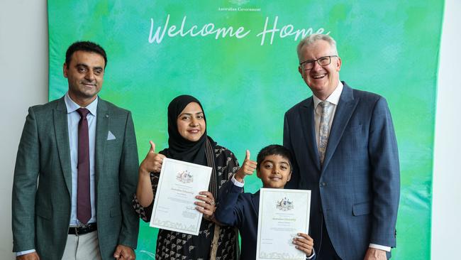 Ahmed Bosan, Aroob Fatima and Ali Bosan, 8, with Home Affairs Minister Tony Burke at a WA citizenship ceremony at Perth Convention Centre on February 27. Picture: Colin Murty