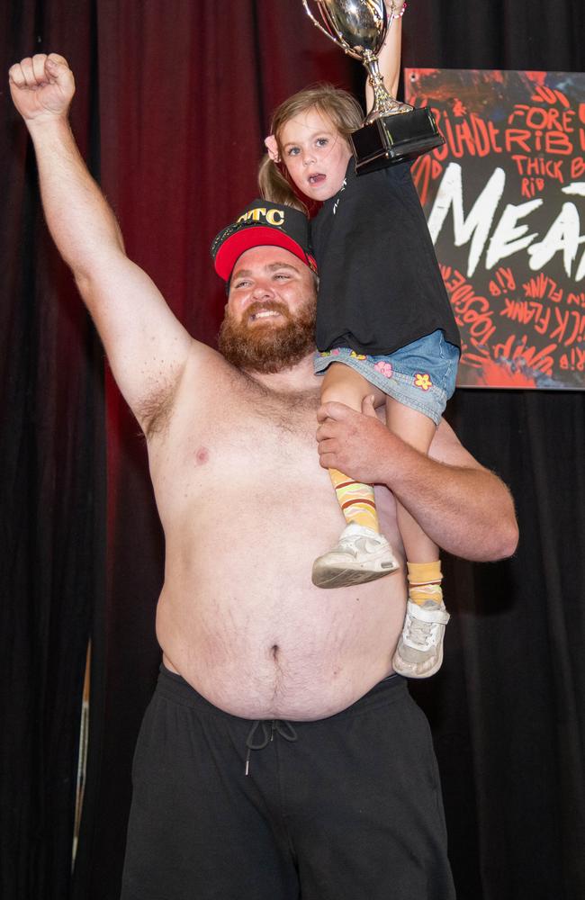 Winner of the Best Dad Body competition, Luke Billin with his daughter Madalin. Meatstock – Music, Barbecue and Camping Festival at Toowoomba Showgrounds. Saturday March 9th, 2024 Picture: Bev Lacey