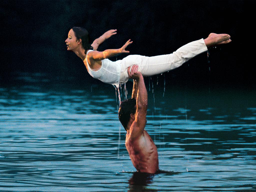 Dirty Dancing stars Patrick Swayze and Jennifer Grey at the lake in the film.