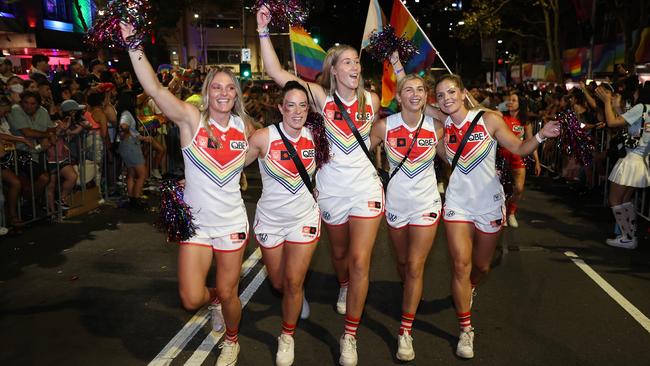 Sydney Swans AFLW players Lisa Steane, Brooke Lochland, Bella Smith, Maddy Collier, and Alana Woodward walk in the Sydney Gay & Lesbian Mardi Gras Parade as part of Sydney WorldPride on February 25, 2023. The Sydney Gay and Lesbian Mardi Gras parade returned to Oxford Street in celebration of the event's 45th anniversary. Photo: Brendon Thorne/Getty.
