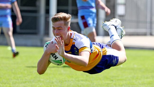 A flying Sanders plants the ball for Pats. Picture: Toby Zerna