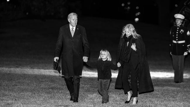 Biden, grandson Beau Biden and first lady Jill Biden walk off Marine One on the south lawn at the White House in December. Photo: Tasos Katopodis/Getty Images