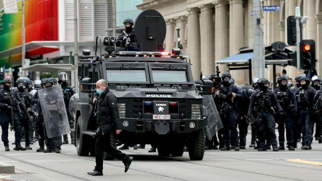 Dozens of police vehicles were deployed throughout the CBD. Picture: Con Chronis/AFP
