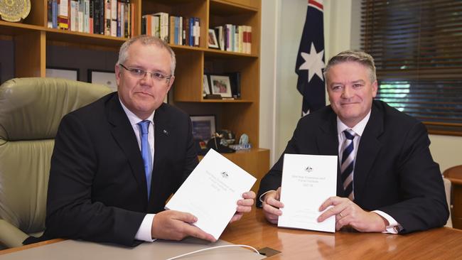 Scott Morrison (left) and Finance Minister Mathias Cormann delivered the Mid-Year Economic and Fiscal Outlook at Parliament House in Canberra yesterday. Picture: AAP