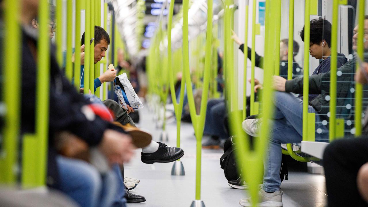 Commuters seen on the opening day of the Sydney Metro. Picture: Max Mason-Hubers/NCA NewsWire