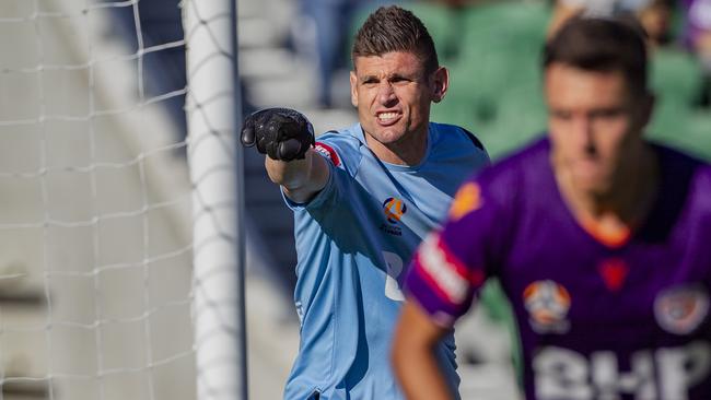 Perth Glory goalkeeper Liam Reddy issues instructions during their opening-round match against Brisbane Roar. Picture: AAP