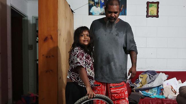 A monsoonal tropical low pressure system has brought devastating widespread flooding to North Queensland and parts of Cardwell in Far North Queensland,Bill Dunrobin and his six year old daughter Daisy Dunrobin moved from Brisbane to Cardwell one year ago with two bags of clothes. After building up their lives in their new home, all of their possessions were lost in a few hours on Sunday night after flood waters rushed through their Roma Street property. Picture: Brendan Radke