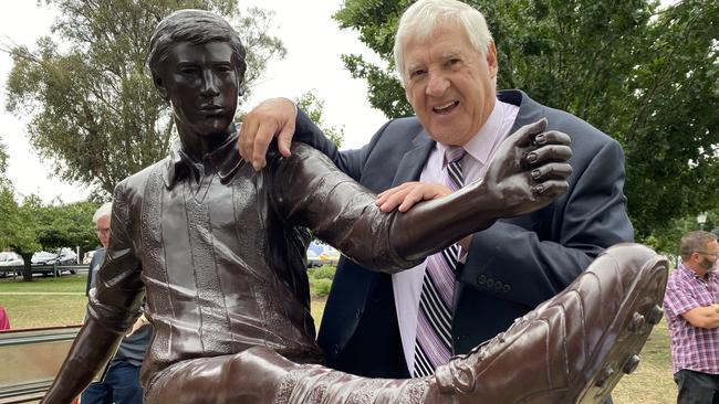 Tasmanian footy legend Peter Hudson with the statue unveiled in his honour today in the town where it all started – New Norfolk. Picture: James Bresnehan