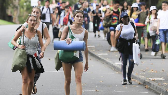 Crowds flock into Mrs Macquarie's Chair to claim positions for tonight's New Year’s Eve celebrations in Sydney. Picture: Dylan Robinson